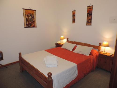 A bed or beds in a room at Hotel Aldea Marina