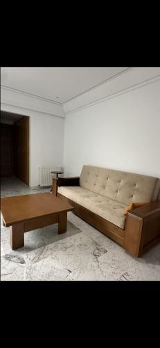 a living room with a couch and a coffee table at S1 terrace jc in Tunis