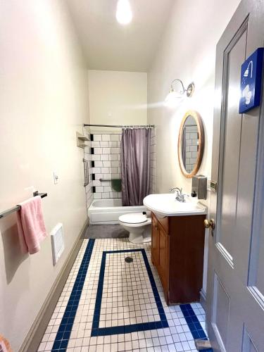 a bathroom with a toilet and a sink at Northwest Portland Hostel in Portland