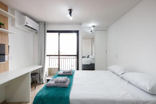 Postel nebo postele na pokoji v ubytování Sanloft Comfort Expo Tiete Top 1