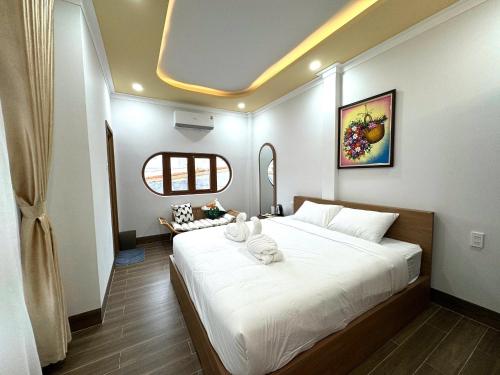 Ένα ή περισσότερα κρεβάτια σε δωμάτιο στο Linh House