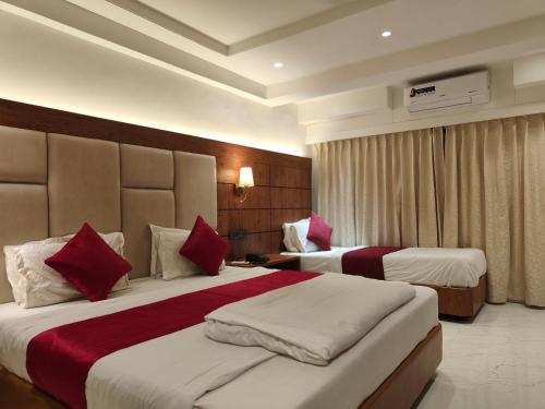 Katil atau katil-katil dalam bilik di Hotel Anand Palace