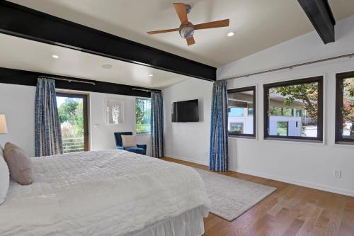a bedroom with a bed and a ceiling fan at Masons View by Sea Scape Properties in Wrightsville Beach