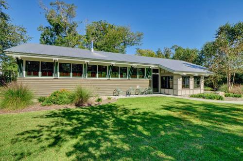 a house with a large yard in front of it at Masons View by Sea Scape Properties in Wrightsville Beach