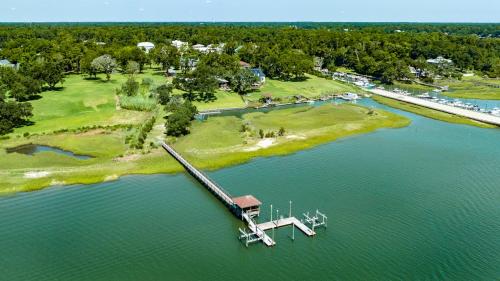 an island in the middle of a lake with a dock at Masons View by Sea Scape Properties in Wrightsville Beach