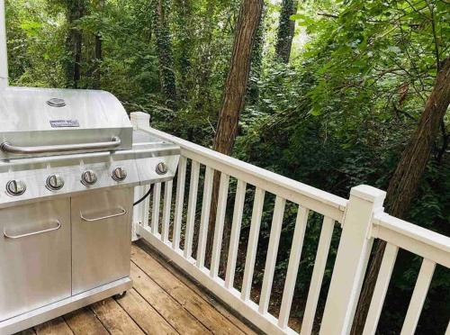 a grill on the deck of a house at Gorgeous Modern 4-Level 4BDR Home in Central Location Parking Included Free Cancellation in Washington, D.C.