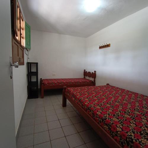 Onda Colorida - Praia de Serrambi CASA 2 - VERDEにあるベッド