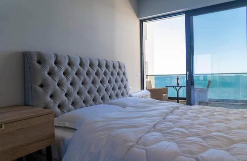 Voodi või voodid majutusasutuse Golden Beach Residence - Luxury Apartments toas