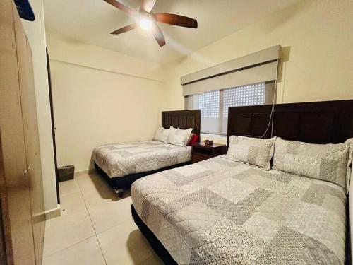 Postel nebo postele na pokoji v ubytování Departamento frente al mar en zona cerritos