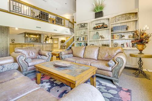 a living room with couches and a coffee table at Iron Horse Studio with Resort Amenities Walk to WP! in Winter Park