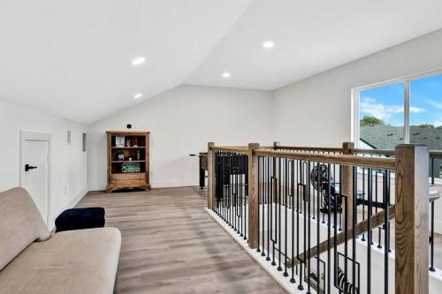 a living room with a couch and a large window at Perfect Dallas Oasis l Pet Friendly l Big Backyard in Oldham