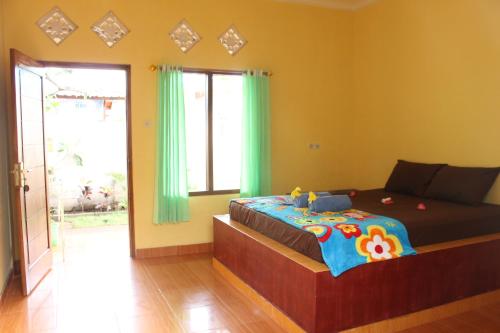 Кровать или кровати в номере Melbao Homestay