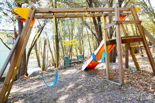 a playground with a slide in a park at Pine Hills Cabin in Julian in Julian
