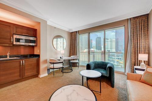 a living room with a view of a city at Amethyst Suite II Balcony STRIP VIEW MGM Signature in Las Vegas