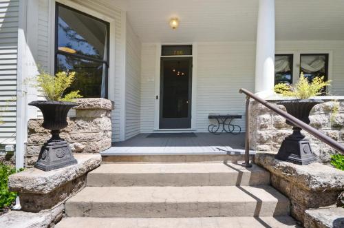 a front porch of a home with stairs and a door at Sonoma Victorian In Heart Of Sonoma in Sonoma