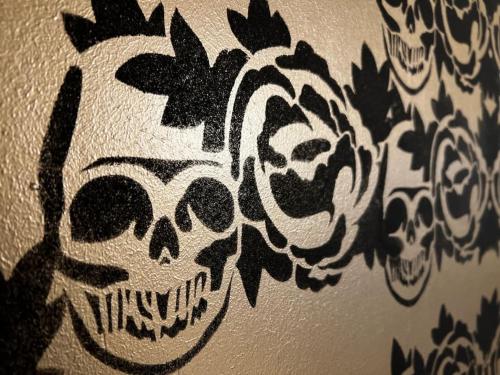 a wall with drawings of skulls on it at VILLA Philipp Plein - Designervilla mit Pool & SPA in Amriswil
