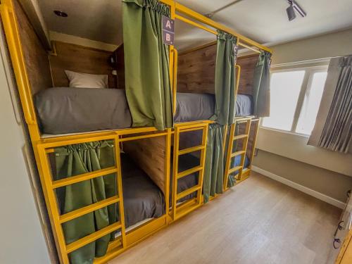 a group of bunk beds in a room at Viajero Arequipa Hostel in Arequipa