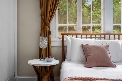 a bedroom with a bed and a window at The Gallery at Duckpond - 1930s Historic Charm in Gainesville