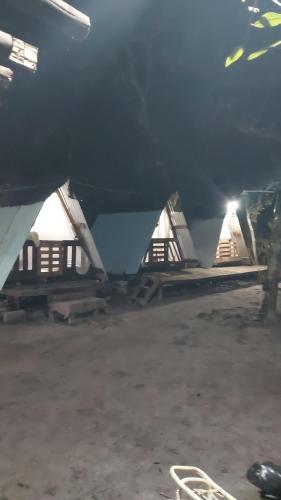 a plane parked in a building with a pile ofsolete at Camping rock in Itanhaém