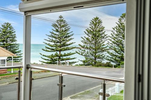 a window view of the ocean from a beach house at Horseshoe View 1A Scrymgour Rd Port Elliot - No Linen Included in Port Elliot