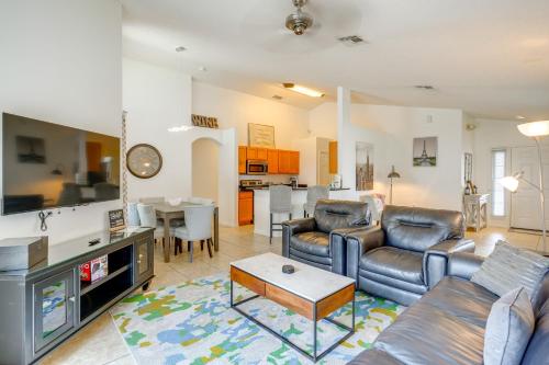 a living room with a couch and a table at 30 Mi to Universal Epic Universe Golf Club Villa in Haines City