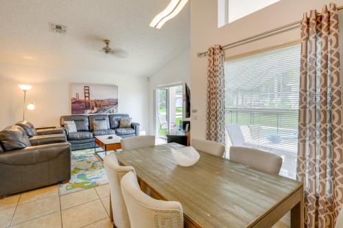 a living room with a table and chairs and a couch at 30 Mi to Universal Epic Universe Golf Club Villa in Haines City