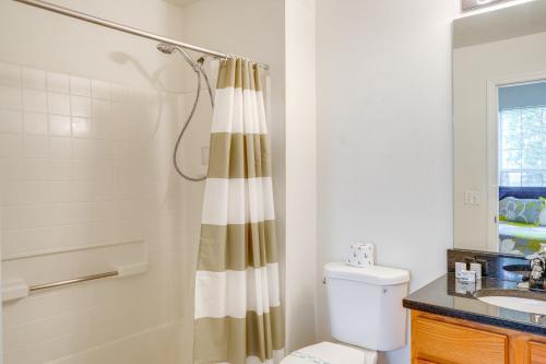 a bathroom with a shower curtain and a toilet at 30 Mi to Universal Epic Universe Golf Club Villa in Haines City