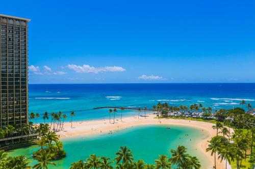 an aerial view of a beach with palm trees and the ocean at Ilikai Tower 1340 Lagoon View 1BR in Honolulu