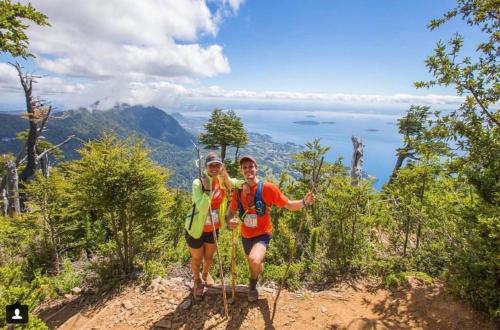 two people standing on top of a mountain at Cabañas Futrono in Futrono