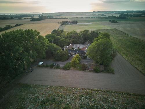 an aerial view of a house in a field at Askegaarden Apartments in Sandved