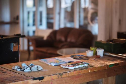 a wooden table with food on top of it at Askegaarden Apartments in Sandved