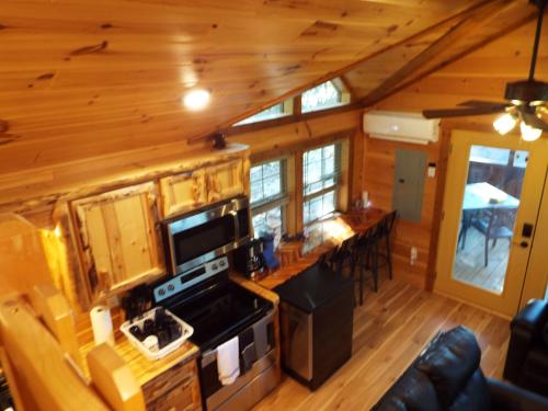 an overhead view of a kitchen and living room in a log cabin at The Timber Cabin in Marshall