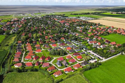 an aerial view of a residential suburb with red roofs at Ferienhaus Mellumplate 37 in Dorum Neufeld