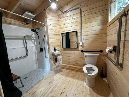 a wooden bathroom with a toilet and a shower at Sunken Escapes Unit 6 ZEEK in New Minas