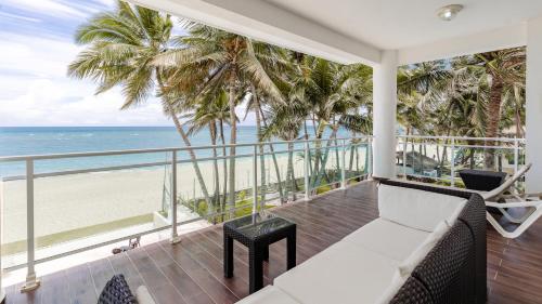 a balcony with a view of the beach at Watermark Luxury Oceanfront Residences in Cabarete