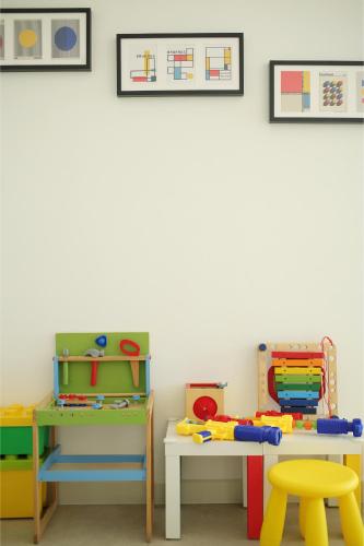 a room with play furniture and pictures on the wall at Afiniti 2BR Sunlit Designer - 3 Min To Legoland in Iskandar Puteri