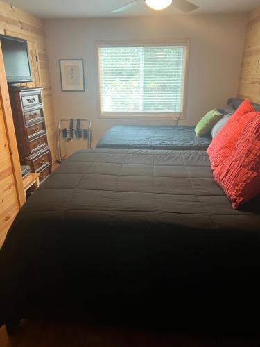 a bedroom with a large bed and a window at SEWARD APARTMENT in Seward