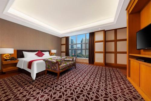 Postel nebo postele na pokoji v ubytování Vanburgh Hotel - Free shuttle bus transfer during Canton Fair