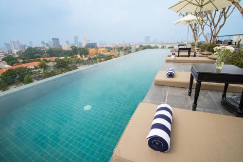 a swimming pool on top of a building at GLOW PARK HOTEL Grand Royal Palace in Phnom Penh