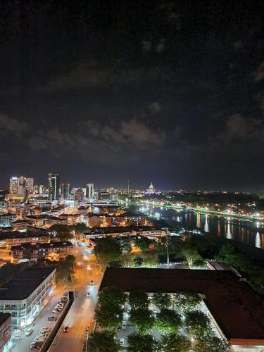 a view of a city at night with lights at Blue Cove Riverine Diamond Kuching in Kuching