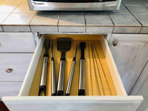 a drawer with knives and utensils in it at Malibu Ocean Villa with King Bed, Hot Tub, Beach, BBQ in Malibu