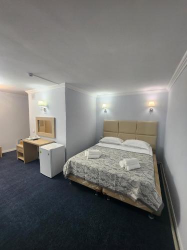 Кровать или кровати в номере Baiterek Premium