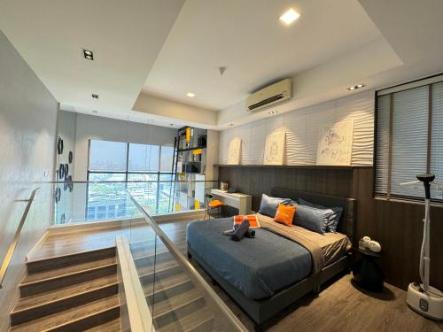 a bedroom with a bed and a balcony on a ship at X - The Library Icon City Petaling Jaya Subang Airport in Sungai Way