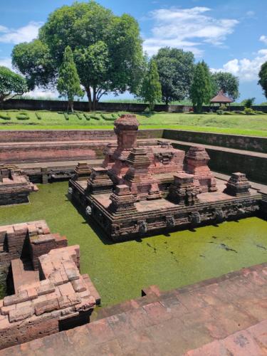 a model of a building in a body of water at GRHA PAWITRA TROWULAN in Trowulan