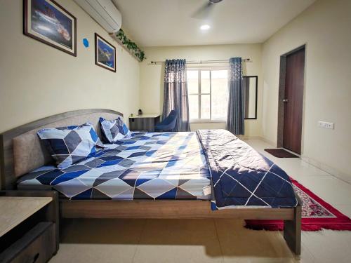 Cama o camas de una habitación en Symphony Apartments at MIHAN Nagpur