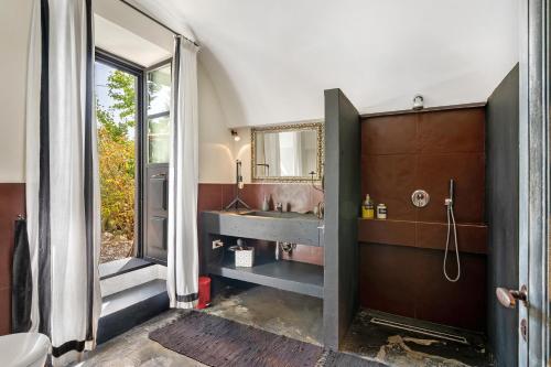 a bathroom with a sink and a mirror at Villa Cangiani in Massa Lubrense