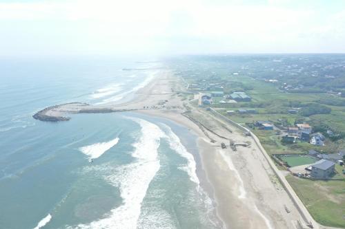 an aerial view of the beach and ocean at グランピングカシマ753 in Kashima