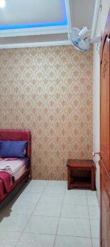 Postel nebo postele na pokoji v ubytování Homestay Sutrisno