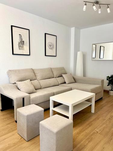 a living room with a couch and a table at Lucus Urban Centre in Lugo