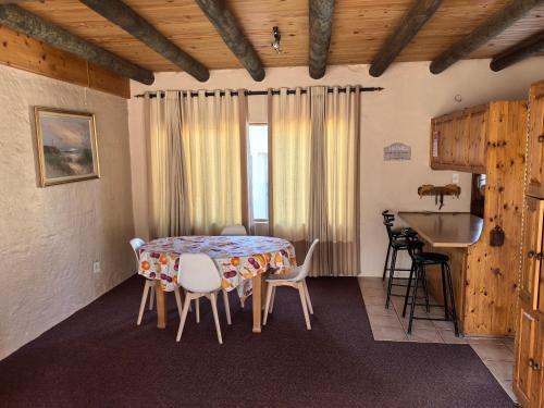 a dining room with a table and chairs at Botterblom 1 in Middelburg